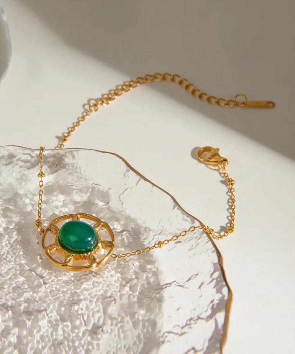 Emerald & gold motif bracelet