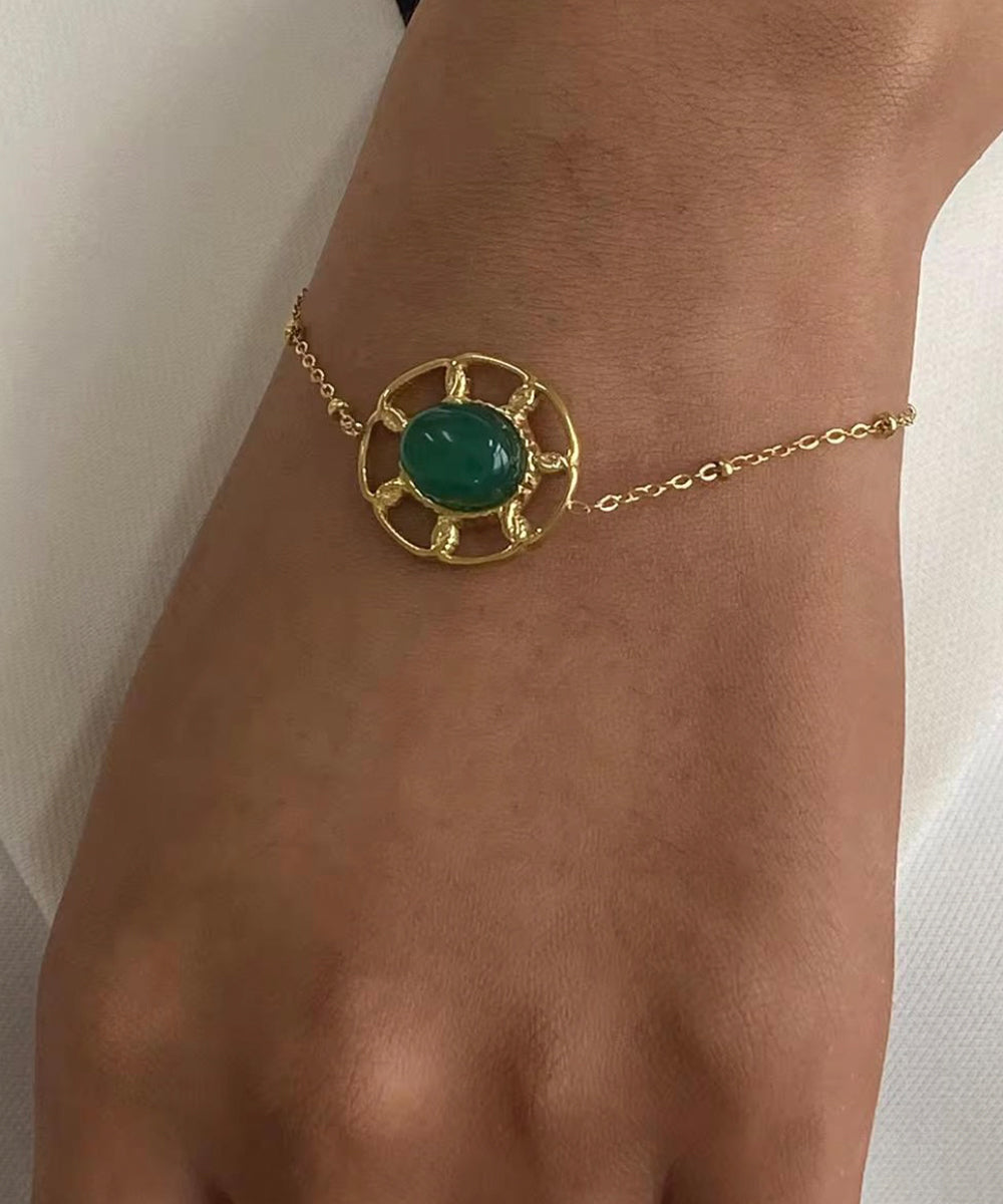 Emerald & gold motif bracelet