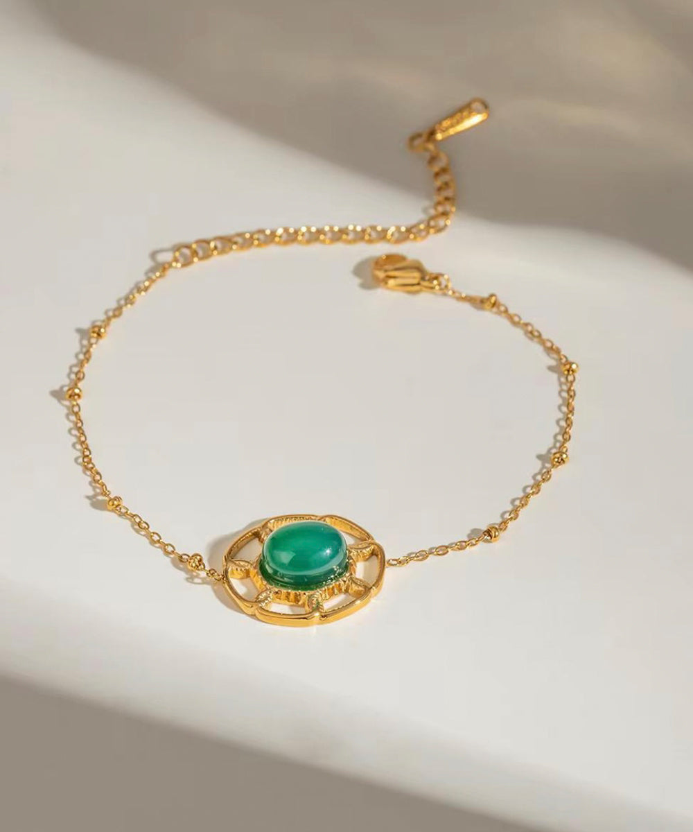 Emerald & gold motif bracelet